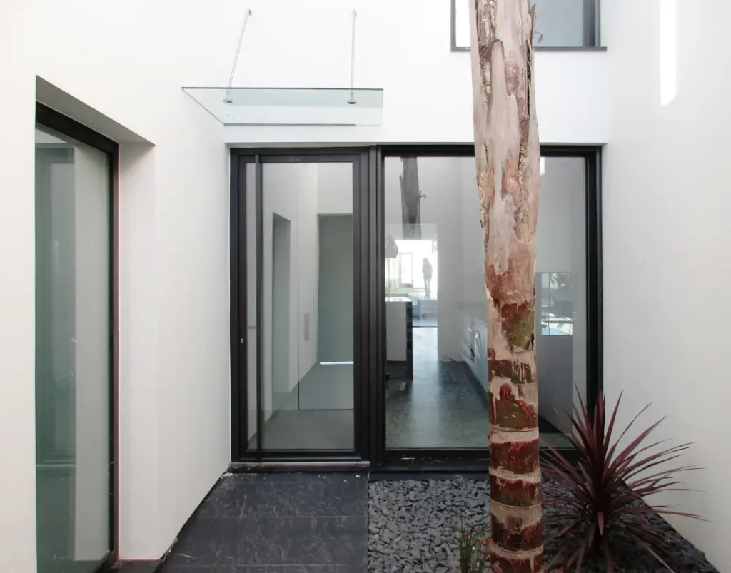 Entrance patio with palm trees